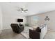 Living room with tiled floors, comfy seating and a large TV at 6807 King Creek Dr, Sun City Center, FL 33573