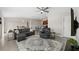Spacious living room with gray sectional sofa and recliner at 6807 King Creek Dr, Sun City Center, FL 33573