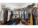 Large walk-in closet with ample hanging space and shelving at 6807 King Creek Dr, Sun City Center, FL 33573