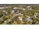 Aerial view of a house and surrounding neighborhood, showcasing the property's location and landscape at 9502 59Th E Ave, Bradenton, FL 34202