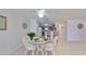 Bright dining area with glass table and wicker chairs, adjacent to the kitchen at 1212 Bayou Pass Dr, Ruskin, FL 33570