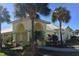 Community clubhouse featuring a yellow facade and arched entryway at 1212 Bayou Pass Dr, Ruskin, FL 33570