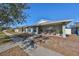 Single-story house with a light gray facade, a porch, and a sidewalk at 1212 Bayou Pass Dr, Ruskin, FL 33570