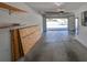 Spacious garage with overhead storage and ample space for vehicles and storage at 1212 Bayou Pass Dr, Ruskin, FL 33570