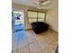 Cozy living room with tile floors and an exterior door at 1000 49Th N St # 104, St Petersburg, FL 33710