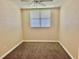 Spacious bedroom with carpeted floors and a ceiling fan at 1003 Beverly Ave, Largo, FL 33770