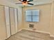 Bedroom with ceiling fan, window blinds and laminate flooring at 1003 Beverly Ave, Largo, FL 33770