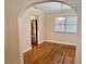 Dining room with hardwood floors and an archway to the kitchen at 1003 Beverly Ave, Largo, FL 33770