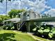 House exterior showcasing a gray building with a fenced backyard at 1003 Beverly Ave, Largo, FL 33770