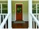 Inviting front door entrance with white railings and a wooden door at 1003 Beverly Ave, Largo, FL 33770