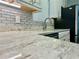 Modern kitchen features granite countertops and updated cabinetry at 1003 Beverly Ave, Largo, FL 33770