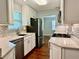 Modern kitchen with white cabinets, granite countertops, and stainless steel appliances at 1003 Beverly Ave, Largo, FL 33770