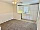 Open concept kitchenette with white cabinets and a breakfast bar at 1003 Beverly Ave, Largo, FL 33770