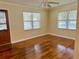 Spacious living room featuring hardwood floors and large windows at 1003 Beverly Ave, Largo, FL 33770