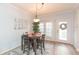 Small dining area with a four-person table and chairs at 10068 Old Haven Way, Tampa, FL 33624