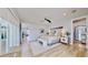 Comfortable main bedroom with wood floors, ensuite bathroom and walk-in closet for a relaxing living space at 10101 Eagle Preserve Dr, Englewood, FL 34224