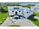 An exterior view of a modern two-story home with well-manicured landscaping and a spacious driveway at 10101 Eagle Preserve Dr, Englewood, FL 34224