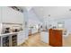 Modern kitchen with white cabinets, stainless steel appliances, and stylish backsplash, offering ample counter space at 10101 Eagle Preserve Dr, Englewood, FL 34224