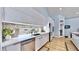 Contemporary kitchen with a view showcasing white cabinets, stainless steel appliances, and modern countertops at 10101 Eagle Preserve Dr, Englewood, FL 34224