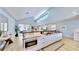 Bright, open kitchen features modern cabinetry, stainless steel appliances, and an eat-in island with seating at 10101 Eagle Preserve Dr, Englewood, FL 34224
