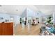 Open living and dining area with wood floors and white walls for a light and airy feel at 10101 Eagle Preserve Dr, Englewood, FL 34224