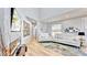 Bright living room with wood floors, modern furniture, and a decorative fireplace for cozy and stylish living at 10101 Eagle Preserve Dr, Englewood, FL 34224