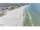 Aerial view of beach with ocean and buildings at 11275 3Rd E St, Treasure Island, FL 33706