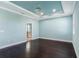 Bright bedroom with hardwood floors and access to a bathroom at 12005 Whistling Wind Dr, Riverview, FL 33569