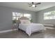 Bright bedroom with a queen-size bed, new flooring, and ample closet space at 1466 Laconia W Dr, Clearwater, FL 33764