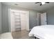 Large bedroom closet with built-in shelving, providing excellent storage at 1466 Laconia W Dr, Clearwater, FL 33764