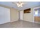 Comfortable bedroom with tile floors, ceiling fan, and built-in closet at 14723 54Th N Way, Clearwater, FL 33760