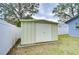 Metal storage shed in backyard provides extra storage at 14723 54Th N Way, Clearwater, FL 33760