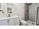 Modern bathroom with white vanity and a walk-in shower at 16249 Vauxhall Dr, Spring Hill, FL 34610