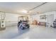 Garage with golf cart, storage, and workbench at 1806 Wedge Ct, Sun City Center, FL 33573