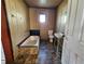 Bathroom with vintage tub, sink, and toilet at 2005 E Columbus Dr, Tampa, FL 33605