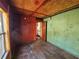 Bedroom with wood floors and two-toned walls at 2005 E Columbus Dr, Tampa, FL 33605