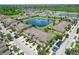 Aerial view of community with lake and homes at 2044 Hawks View Dr, Ruskin, FL 33570