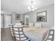 Elegant dining room with a chandelier and hardwood floors at 219 98Th Ne Ave, St Petersburg, FL 33702