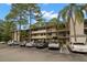 Condo building with ample parking for residents at 3038 Eastland Blvd # F205, Clearwater, FL 33761