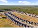 Aerial view showing a house situated in a neighborhood bordering a golf course at 30851 Water Lily Dr, Brooksville, FL 34602