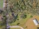 Aerial view showing house, shed, and surrounding land at 3106 E Trapnell Rd, Plant City, FL 33566
