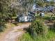 Aerial view of a charming house on a large lot at 3106 E Trapnell Rd, Plant City, FL 33566