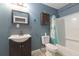 Simple bathroom with tub, toilet, and dark brown vanity at 3106 E Trapnell Rd, Plant City, FL 33566
