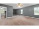Spacious bedroom with neutral carpeting and large windows at 3106 E Trapnell Rd, Plant City, FL 33566
