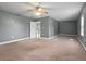 Spacious bedroom with carpeted floors and ceiling fan at 3106 E Trapnell Rd, Plant City, FL 33566