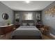 Stylish bedroom with a bed, dresser, and artwork at 3106 E Trapnell Rd, Plant City, FL 33566