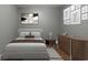 Bright bedroom with a double bed, dresser, and artwork at 3106 E Trapnell Rd, Plant City, FL 33566