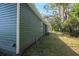 Side view of a blue house with white trim at 3106 E Trapnell Rd, Plant City, FL 33566
