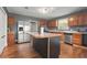 Kitchen with island, stainless steel appliances, and wood cabinets at 3106 E Trapnell Rd, Plant City, FL 33566