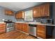 Kitchen with wood cabinets, stainless steel appliances, and island at 3106 E Trapnell Rd, Plant City, FL 33566